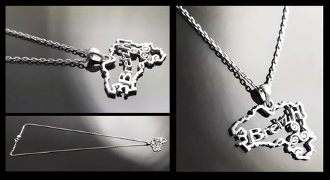 Multiple view of a silver necklace with a pendant shaped like the outline of the state of  'Breizh' (Brittany) in France. The pendant has the word 'Breizh' written inside the outline.
Brand: KRAMIKE
Product: Brittany map necklace / Breizh pendant
Metal: 925 sterling silver
Pendant size: 3.0 × 2.0 cm
Weight: 3.6 g
Symbol: Triskel (center detail)
Chain options: 45 cm / 50 cm / 55 cm
Ships from: France
Tracking: included