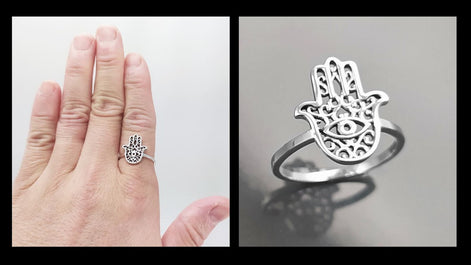 ring worn by a woman hand
Product type: ring
Material: sterling silver
Color: silver
Style: spiritual, symbolic, boho, delicate
Design details: Hamsa hand motif, centered evil eye symbol, openwork detailing, slim sterling silver band, minimalist everyday silhouette
Best for: everyday wear, symbolic jewelry lovers, spiritual gifting, protection-themed jewelry, stacking, birthdays, anniversaries, Mother’s Day