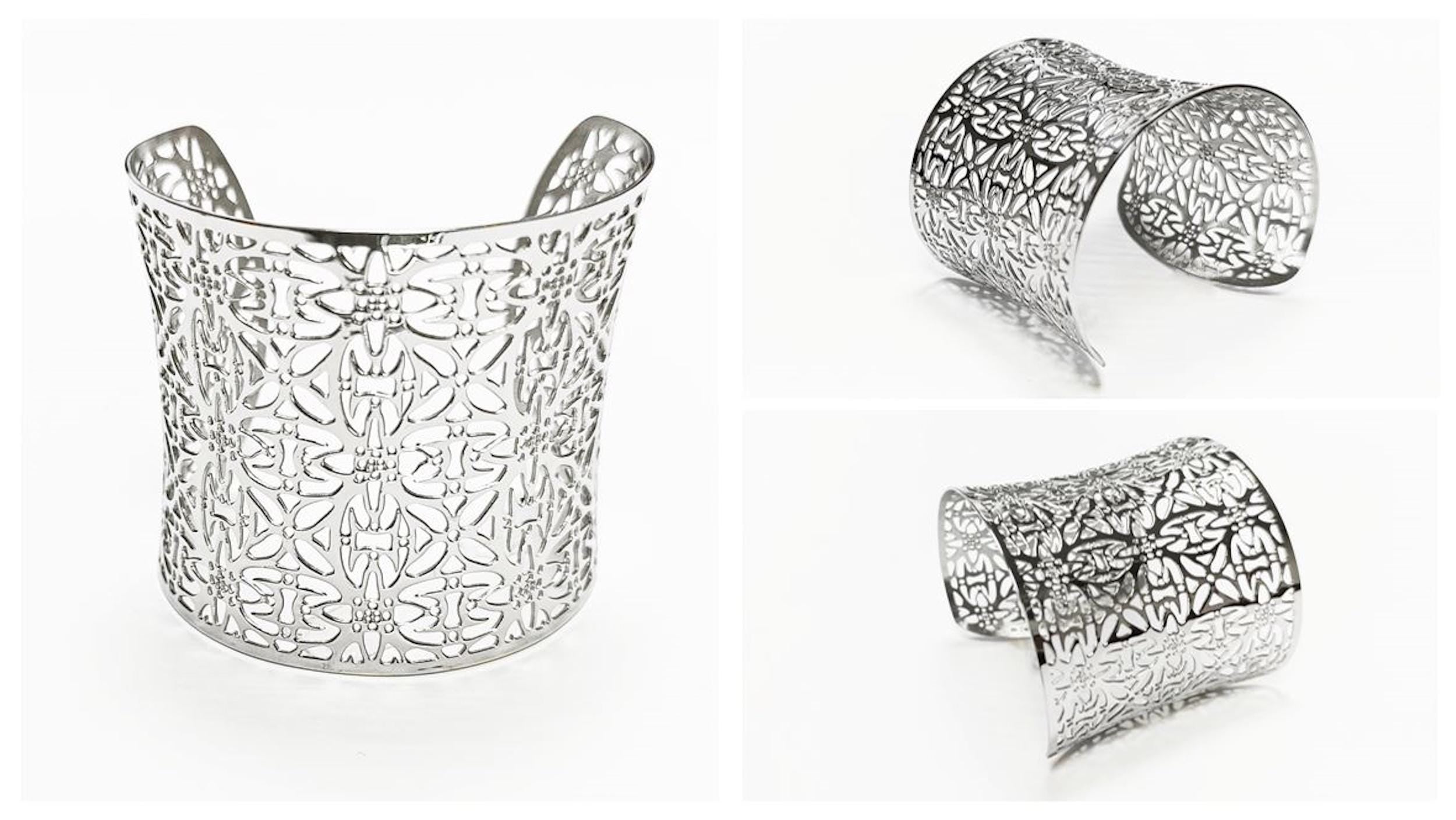 A silver-colored cuff bracelet with an openwork floral design. The wide bracelet has a curved shape and is shown in multiple views against a white background. The intricate pattern is visible throughout the piece.

Brand: KRAMIKE
Type of jewelry: cuff / statement armor cuff
Metal: stainless steel
Color: silver-tone
Style: Filigree floral lace / modern boho
Diameter: 66 mm
Width: 60 mm
Ships from: France