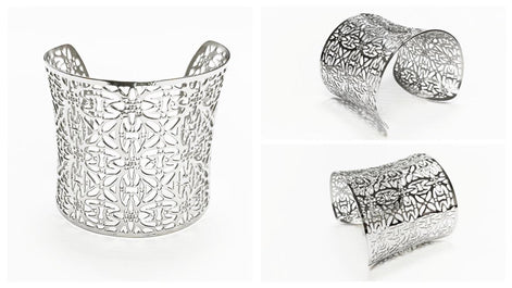 A silver-colored cuff bracelet with an openwork floral design. The wide bracelet has a curved shape and is shown in multiple views against a white background. The intricate pattern is visible throughout the piece.

Brand: KRAMIKE
Type of jewelry: cuff / statement armor cuff
Metal: stainless steel
Color: silver-tone
Style: Filigree floral lace / modern boho
Diameter: 66 mm
Width: 60 mm
Ships from: France