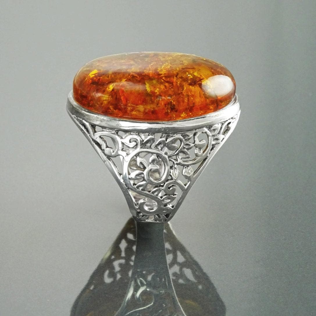 Vintage-style Cognac-colored Oval Amber 925 Silver Ring with laurel branches.