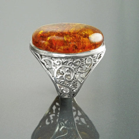 Vintage-style Cognac-colored Oval Amber 925 Silver Ring with laurel branches.