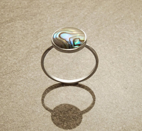 Round abalone ring, sterling silver set with genuine paua shell in a modern geometric stone design