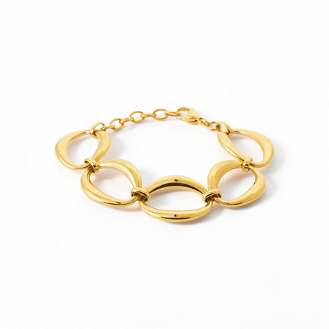 View of a Gold Oval Link Bracelet closed, on a white background
Material:  18K Gold Filled, stainless steel base
Color: yellow gold
Style: modern, elegant, statement, minimalist
Design details: large polished open oval links, smooth rounded profile, sculptural chain design, lobster clasp with extender
Best for: everyday elevated wear, statement styling, gifting, special occasions, modern jewelry lover