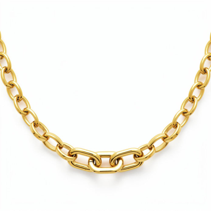 View of the necklace in a studio white background.
Product type: necklace
Material: 18K Gold Filled, stainless steel base
Color: yellow gold
Style: modern, elegant, minimalist, slightly bold
Design details: mixed link chain, paperclip-style center links, rounded oval side links, polished finish, lobster clasp, extender chain
Best for: everyday wear, layering, gifting, modern jewelry lovers, statement minimal styling