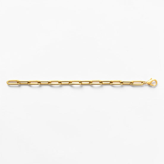 View of the bracelet in a studio white background.
Product type: bracelet
Material: 18K Gold Filled, stainless steel base
Color: yellow gold
Style: modern, elegant, minimalist, slightly bold
Design details: rectangular link chain, paperclip-style link, polished finish, lobster clasp
Best for: everyday wear, layering, gifting, modern jewelry lovers, statement minimal styling