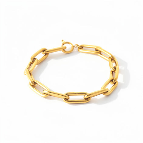 View of the bracelet in a studio white background.
Product type: bracelet
Material: 18K Gold Filled, stainless steel base
Color: yellow gold
Style: modern, elegant, minimalist, slightly bold
Design details: rectangular link chain, paperclip-style link, polished finish, lobster clasp
Best for: everyday wear, layering, gifting, modern jewelry lovers, statement minimal styling