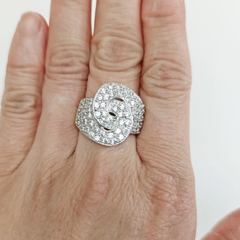 view worn by a woman hand
Product type: ring
Material: 925 sterling silver
Stone: diamond
Color: silver and clear white
Style: bold, statement, edgy, elegant
Design details: handcuff-inspired motif, pavé diamond surface, wide sculptural band, polished sterling silver finish, statement silhouette
Best for: statement styling, special occasions, fashion-forward looks, gift giving, women who love unique sterling silver diamond jewelry
