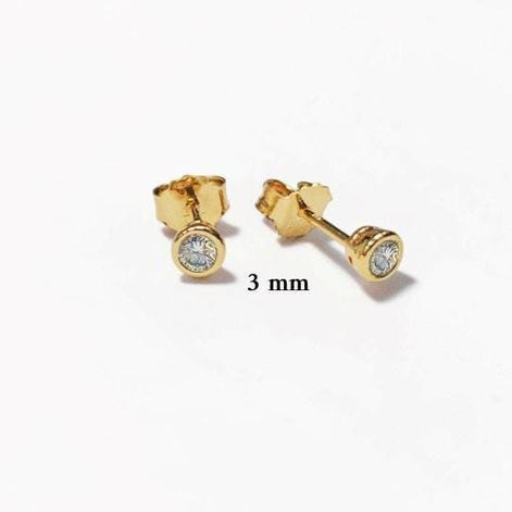 Product type: stud earrings
Material: gold
Stone: diamond 3mm 
Color: gold and clear white
Style: minimalist, classic, elegant, fine jewelry
Design details: round bezel-set diamonds, polished gold setting, stud earring silhouette, available in multiple sizes, timeless everyday design
Best for: everyday wear, second piercings, stacking, bridal jewelry, anniversary gifts, birthday gifts, fine jewelry lovers