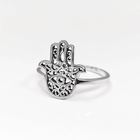 Product type: ring
Material: sterling silver
Color: silver
Style: spiritual, symbolic, boho, delicate
Design details: Hamsa hand motif, centered evil eye symbol, openwork detailing, slim sterling silver band, minimalist everyday silhouette
Best for: everyday wear, symbolic jewelry lovers, spiritual gifting, protection-themed jewelry, stacking, birthdays, anniversaries, Mother’s Day