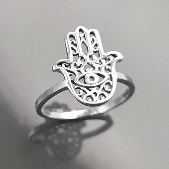Product type: ring
Material: sterling silver
Color: silver
Style: spiritual, symbolic, boho, delicate
Design details: Hamsa hand motif, centered evil eye symbol, openwork detailing, slim sterling silver band, minimalist everyday silhouette
Best for: everyday wear, symbolic jewelry lovers, spiritual gifting, protection-themed jewelry, stacking, birthdays, anniversaries, Mother’s Day