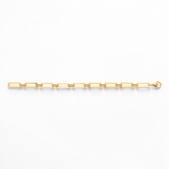 A 18K Gold Filled Paperclip Bracelet lay opened on a white studio background.
Product type: bracelet
Material:  18K Gold Filled, stainless steel base
Color: yellow gold
Style: minimalist, modern, elegant
Design details: elongated rectangular paperclip links, polished finish, geometric chain design, lobster clasp
Best for: everyday wear, layering, gifting, minimalist jewelry lovers, modern capsule wardrobes