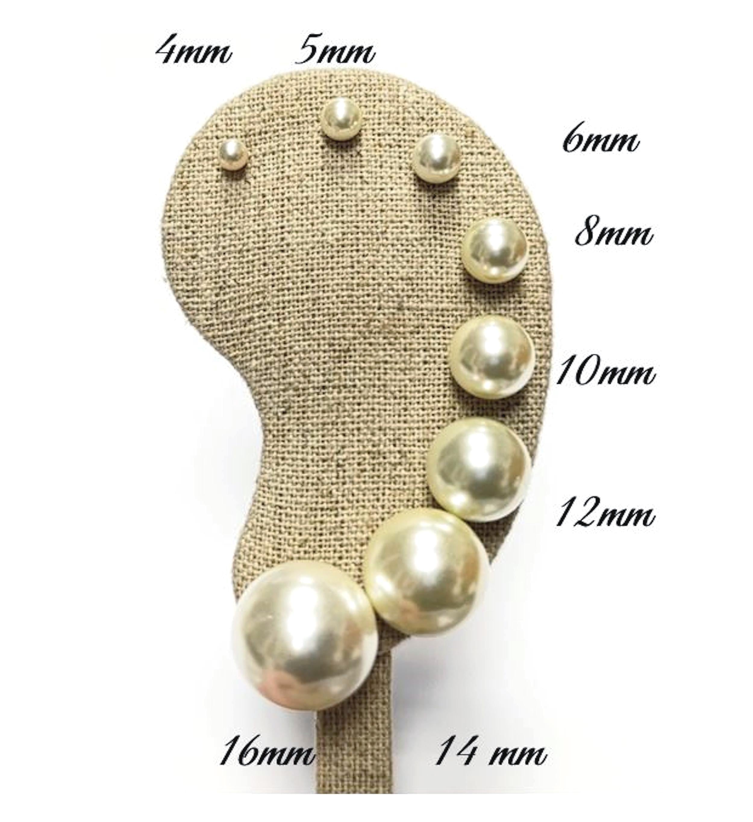Gold Pearl Stud Earrings displayed on an ear-shaped stand
Product type: stud earrings
Material: gold
Stone/material: pearl
Color: gold and cream white
Style: classic, elegant, minimalist, bridal
Design details: round pearl studs, gold post setting, smooth lustrous finish, available in multiple sizes from small dainty studs to larger statement pearl earrings
Best for: everyday wear, bridal jewelry, bridesmaid gifts, birthdays, anniversaries, classic jewelry lovers, women who want timeless studs