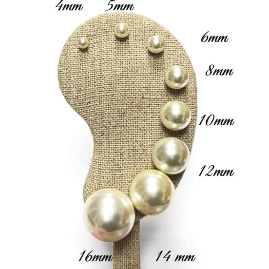 Gold Pearl Stud Earrings displayed on an ear-shaped stand
Product type: stud earrings
Material: gold
Stone/material: pearl
Color: gold and cream white
Style: classic, elegant, minimalist, bridal
Design details: round pearl studs, gold post setting, smooth lustrous finish, available in multiple sizes from small dainty studs to larger statement pearl earrings
Best for: everyday wear, bridal jewelry, bridesmaid gifts, birthdays, anniversaries, classic jewelry lovers, women who want timeless studs