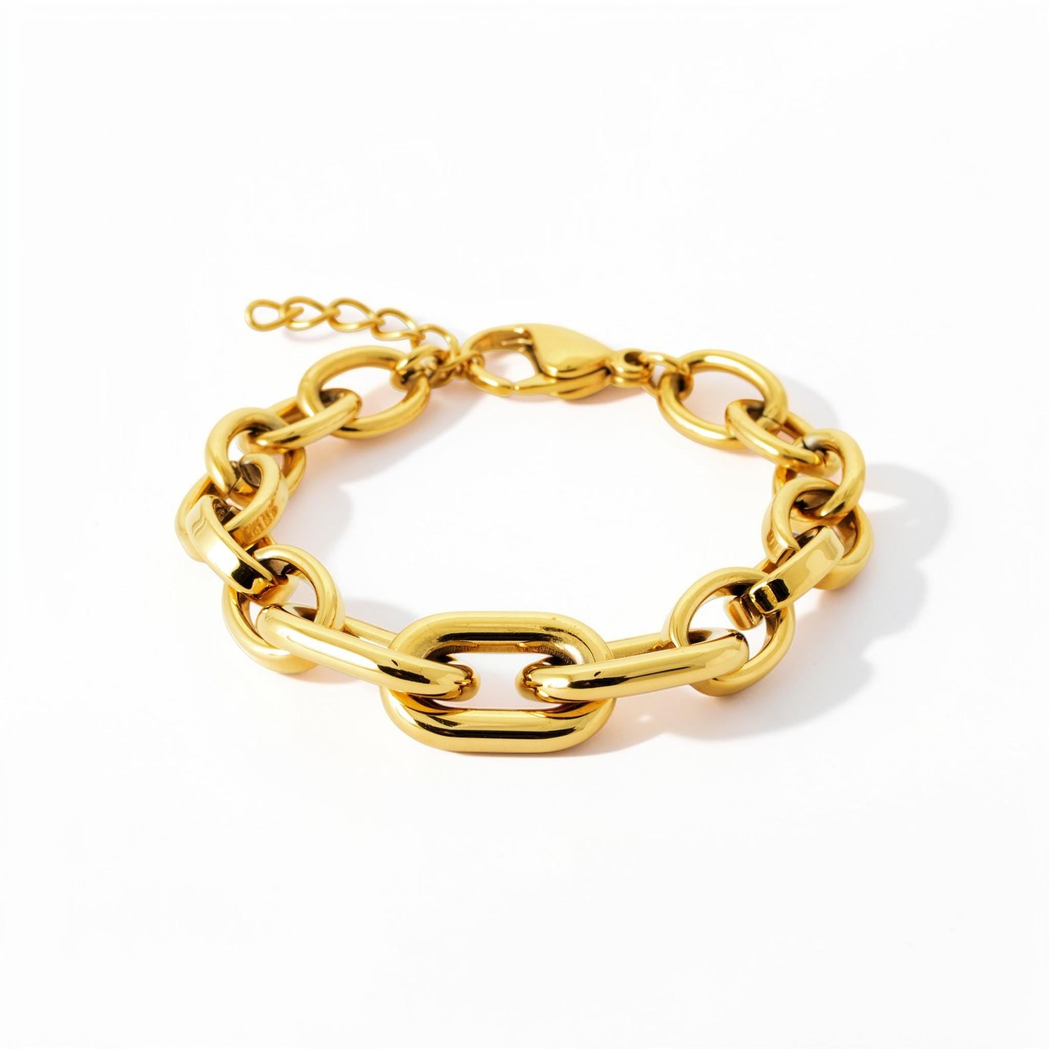 View of the matching bracelet in a studio white background.
Product type: bracelet
Material: 18K Gold Filled, stainless steel base
Color: yellow gold
Style: modern, elegant, minimalist, slightly bold
Design details: mixed link chain, paperclip-style center links, rounded oval side links, polished finish, lobster clasp, extender chain
Best for: everyday wear, layering, gifting, modern jewelry lovers, statement minimal styling