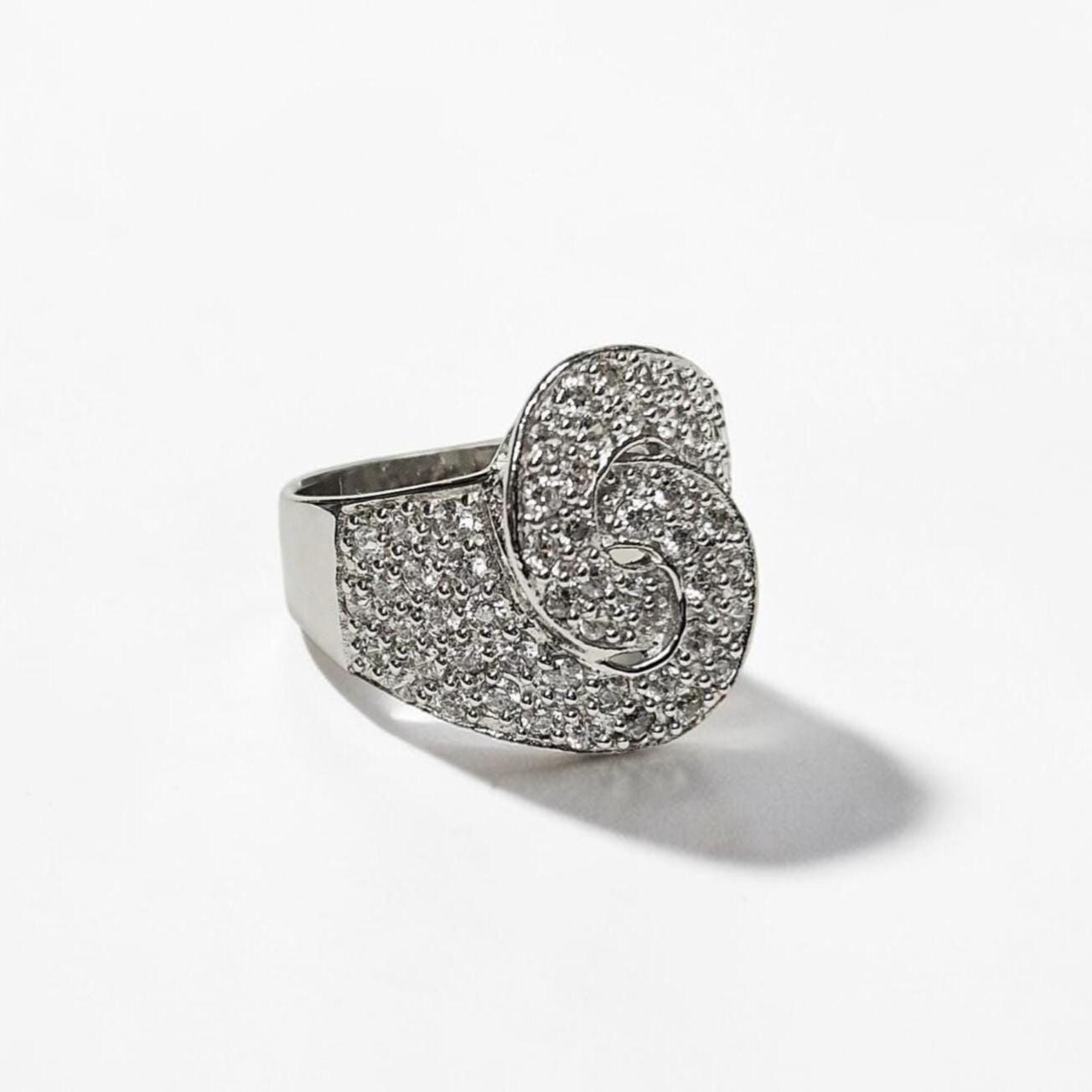 Product type: ring
Material: 925 sterling silver
Stone: diamond
Color: silver and clear white
Style: bold, statement, edgy, elegant
Design details: handcuff-inspired motif, pavé diamond surface, wide sculptural band, polished sterling silver finish, statement silhouette
Best for: statement styling, special occasions, fashion-forward looks, gift giving, women who love unique sterling silver diamond jewelry