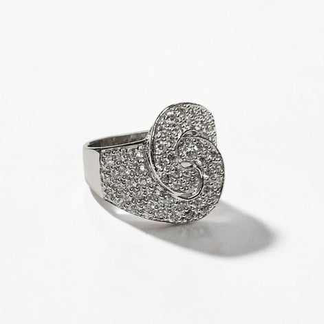 Product type: ring
Material: 925 sterling silver
Stone: diamond
Color: silver and clear white
Style: bold, statement, edgy, elegant
Design details: handcuff-inspired motif, pavé diamond surface, wide sculptural band, polished sterling silver finish, statement silhouette
Best for: statement styling, special occasions, fashion-forward looks, gift giving, women who love unique sterling silver diamond jewelry