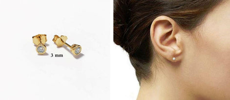 view wore by a woman
Product type: stud earrings
Material: gold
Stone: diamond 3mm 
Color: gold and clear white
Style: minimalist, classic, elegant, fine jewelry
Design details: round bezel-set diamonds, polished gold setting, stud earring silhouette, available in multiple sizes, timeless everyday design
Best for: everyday wear, second piercings, stacking, bridal jewelry, anniversary gifts, birthday gifts, fine jewelry lovers