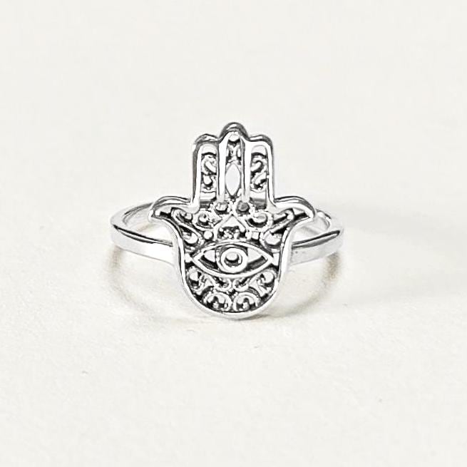 Product type: ring
Material: sterling silver
Color: silver
Style: spiritual, symbolic, boho, delicate
Design details: Hamsa hand motif, centered evil eye symbol, openwork detailing, slim sterling silver band, minimalist everyday silhouette
Best for: everyday wear, symbolic jewelry lovers, spiritual gifting, protection-themed jewelry, stacking, birthdays, anniversaries, Mother’s Day